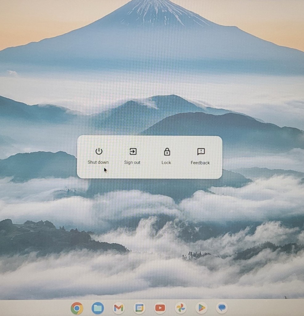 A Chromebook screen with a mouse pointer over the shut down button.